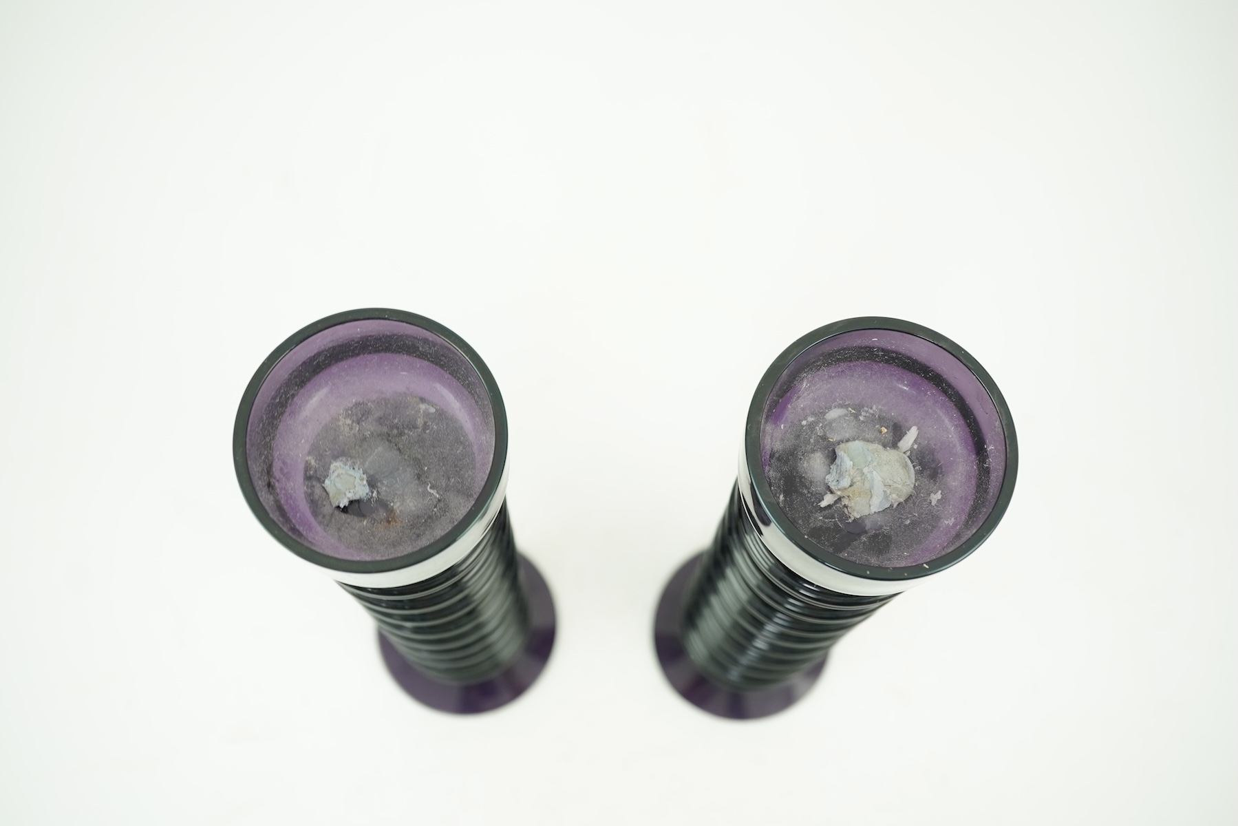 Ronald Stennett-Wilson (1915-2009) for Wedgwood: A pair of nine-ring 'Sheringham' amethyst glass candlesticks